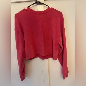 Pink cropped sweater.